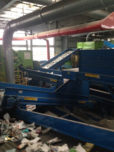 A maze of conveyor belts carries the recyclables throughout the center.