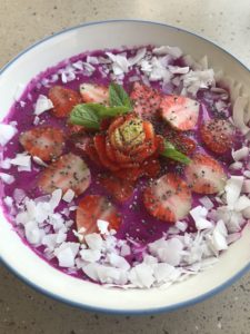 Dragon fruit smoothie bowl for breakfast.