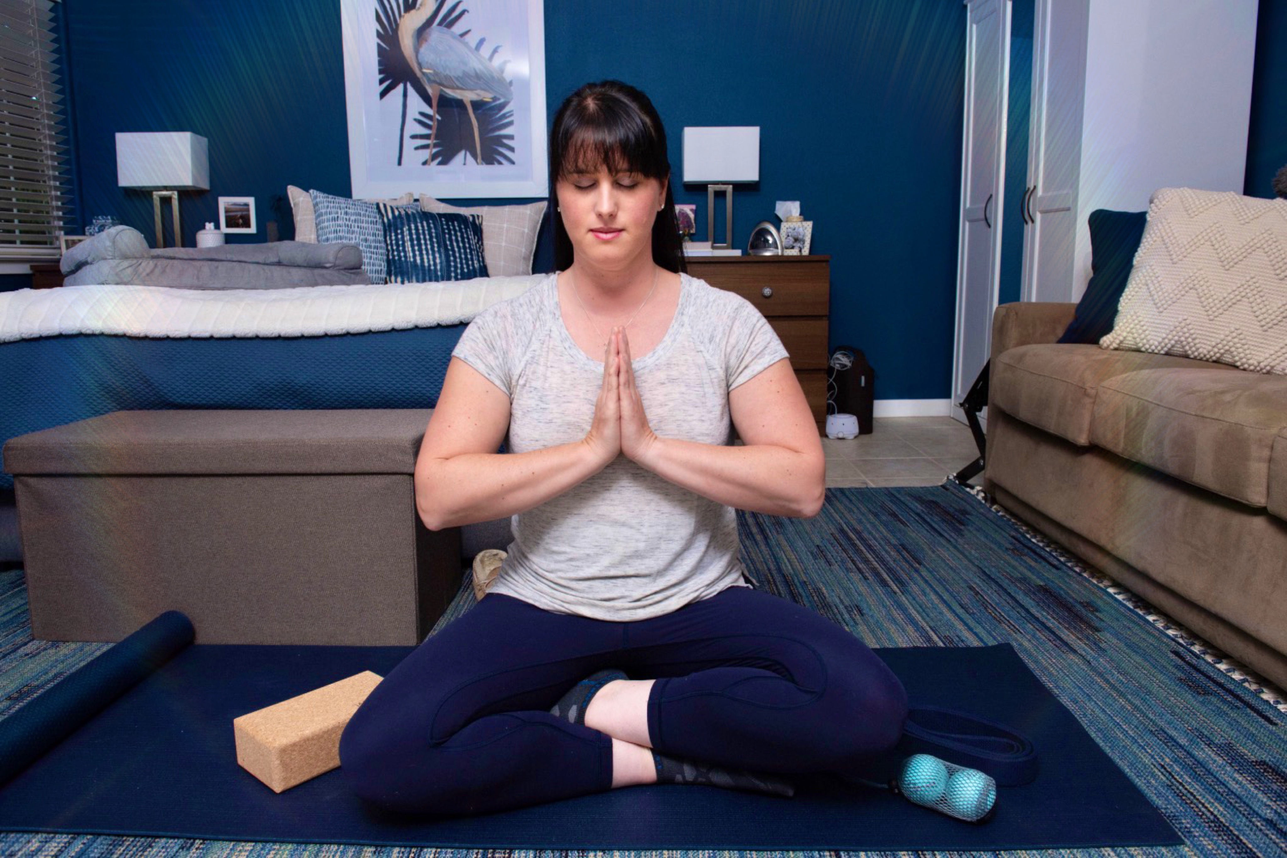 Photograph of LMOI owner Lauren Mang in the Namaste pose, courtesy of Christina Samuelson Photography