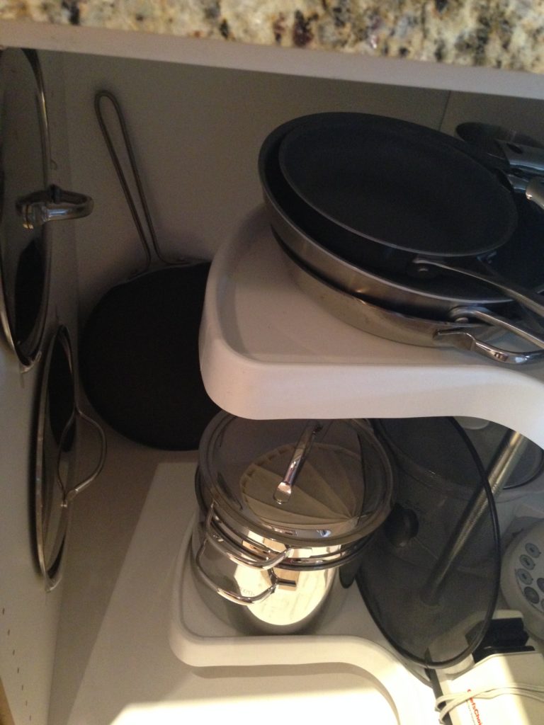 The best use for those lazy susan kitchen cabinets are to store larger kitchen appliances/gadgets, pots/pans and lids.