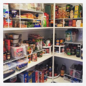 I pulled out all the organizing tricks in this pantry, using shelf risers, lazy susans and baskets/bins to categorize and contain food.